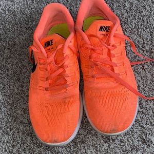 Women’s Nike Free Run Size 10 women’s. Bright Mango/Black-Sunset Glow